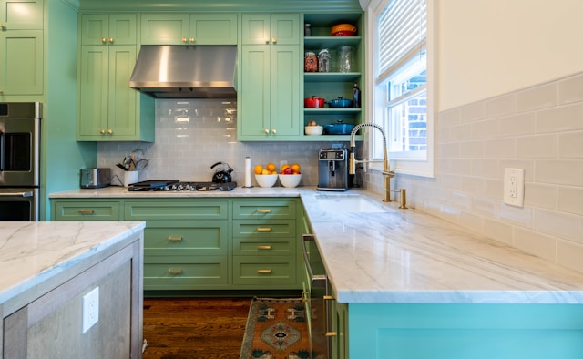 Bright kitchen remodel with island, pendant lights, and wood flooring